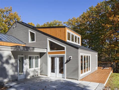 Modern Home With Exterior House Metal Roof Material And Wood Siding