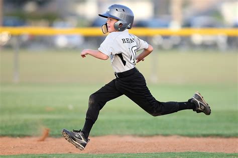 Free Photo Baseball Player In Gray And Black Uniform Running Action