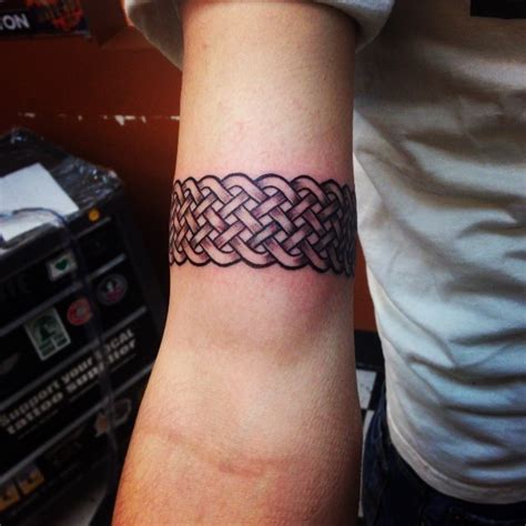 Celtic Style Colored Biceps Tattoo Of Nice Bracelet Tattooimagesbiz