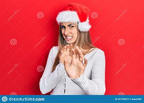 Beautiful Hispanic Woman Wearing Christmas Hat Disgusted Expression Displeased And Fearful