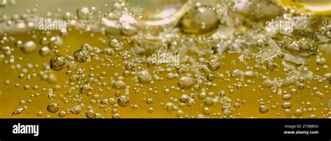 Golden Hyaluron Oil Bubbles Collagen Serum Or Yellow Oil Bubbles Drop Texture Background Liquid