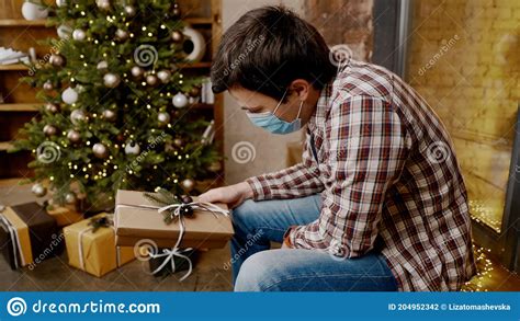 Depressed Man In Medical Mask At Home Christmas Alone Coronavirus On