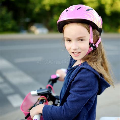 Cute Little Preschooler Girl Riding A Bike In A City Stock Image