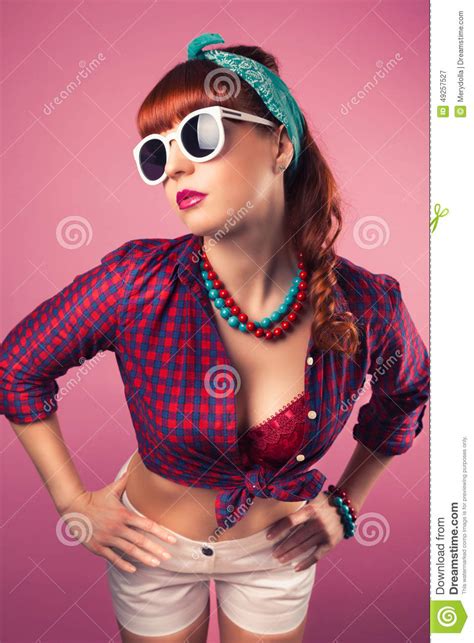 Beautiful Pin Up Girl Posing With White Sunglasses Against Pink Stock