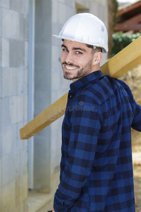 Young Builder Carrying Wood On Shoulder Stock Image Image Of Hardhat