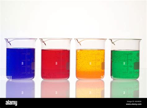 4 Four Beaker Chemical Beakers With Coloured Liquids Stock Photo Alamy