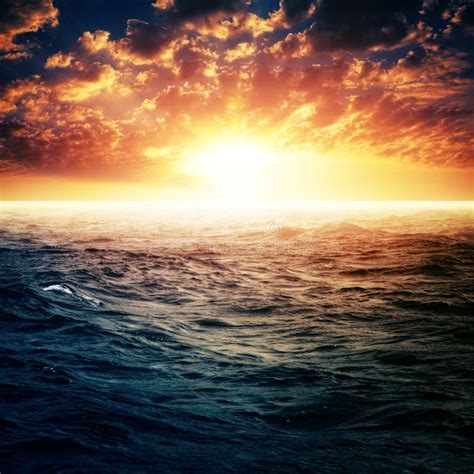Dramatic Sunset Over Ocean Surface Stock Photo Image Of Dramatic