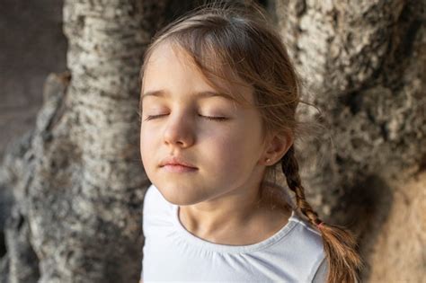 Premium Photo Portrait Little Girl With Eyes Closed