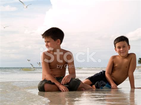 Brothers On A Beach Stock Photo Royalty Free Freeimages