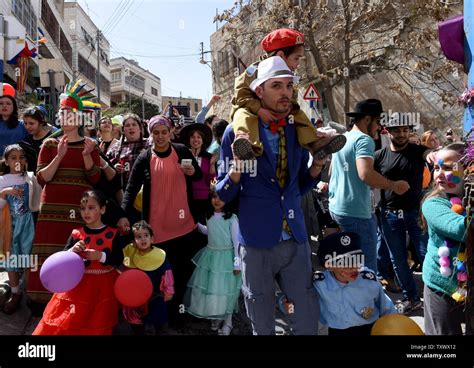 Israeli Settlers Wear Costumes As They Participate In The Annual Purim