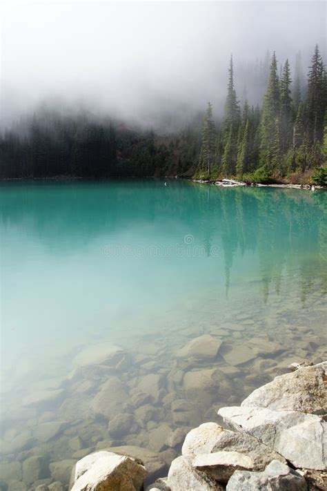 Morning Mist Rising From Turquoise Lake Stock Photo Image Of Nature