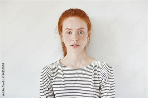 Portrait Of Young Tender Redhead Teenage Girl With Healthy Freckled
