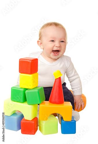 Cheerful Baby Boy Playing With Colorful Blocks Stock Photo And