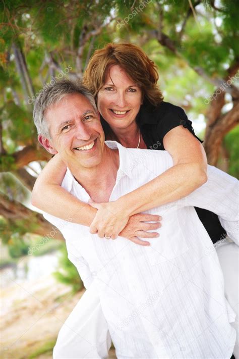 Mature Couple Smiling And Embracing Stock Photo Hannamonika
