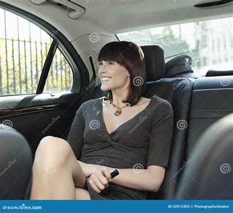 Businesswoman Sitting At Back Seat Of Car Stock Image Image Of Female