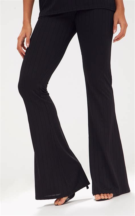 Black Wide Rib Flare Trousers Trousers Prettylittlething Usa