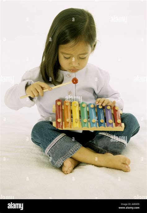 Young Girl Playing With A Xylophone Stock Photo Alamy