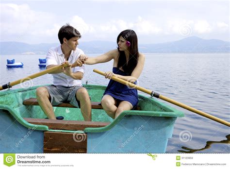 Husband And Wife Fighting On Boat In Vacation On Italian Lake Stock