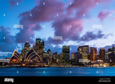 Sydney City Skyline And Harbour Including The Opera House At Dusk