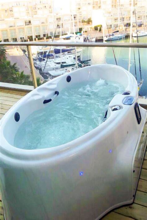 Jacuzzi hot tubs use a mix of 12 powerpro jet types with aquilibrium, jacuzzi's proprietary term for the unique mix of air and water used in jets to create a relaxing hydromassage. Small Balcony Hot Tub | Hot tub, Small hot tub, Hot tub ...