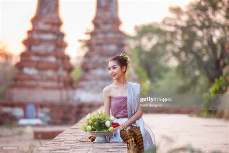 Beautiful Thai Girls In Thai Traditional Costume Trying To Roll Up