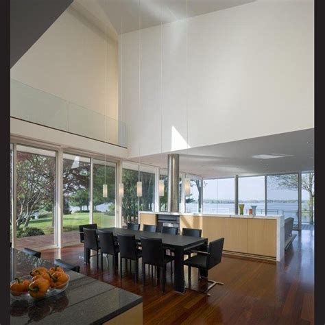 The Double Height Void Over The Dining And Kitchen Area Creates Visual