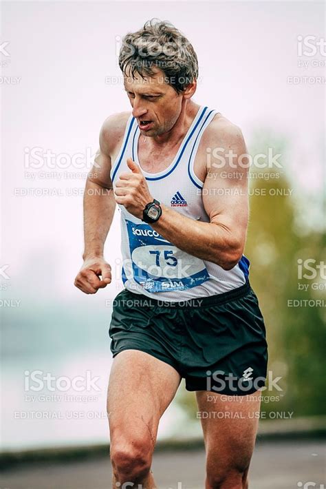 Man Middle Aged Runner Runs Along Rive During Siberian International