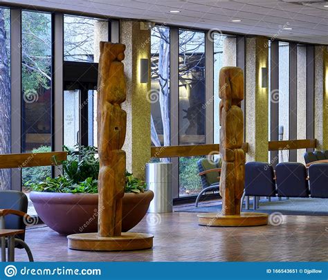`adam` Left And `eve` Right Two Wooden Semi Abstract Sculptures By