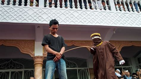 gay sex made punishable by public caning in indonesia s aceh province abc news