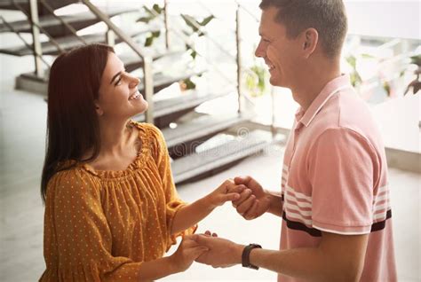 Man And Woman Having Conversation In Hall Stock Image Image Of