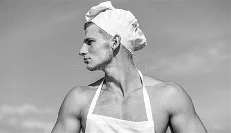 Man On Confident Face Wears Cooking Hat And Apron Sky On Background