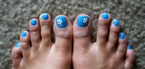 Press the flower to the wet nail polish. Tails to Tell: A Blue Background and a Little White Hibiscus