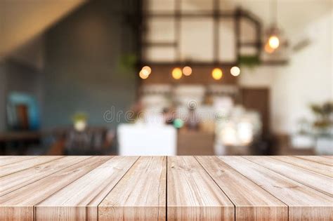 Empty Light Wood Table Top With Blurred In Coffee Shop Background Stock