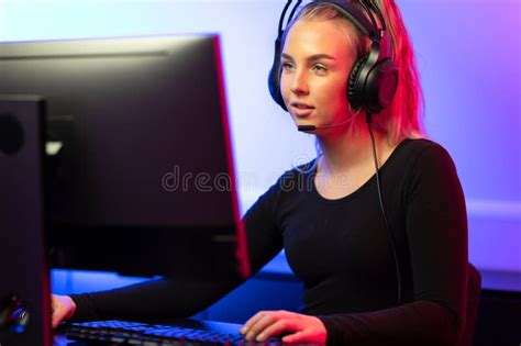 Professional E Sport Gamer Girl With Headset Playing Online Video Game