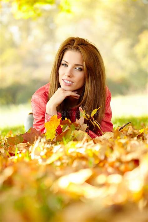 Woman With Autumn Leaves In Hand And Fall Yellow Maple Gar Stock Image