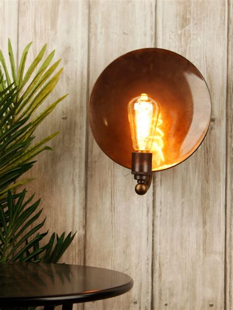 This Sophisticated Wall Light Has A Burnished Copper Dish Shade Which