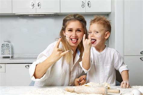Premium Photo Mom And Son Smeared In Flour And Fooling Around