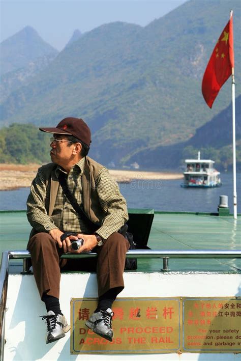 Chinese Tourist At The Boat Floating By The Scenic Li River Inner