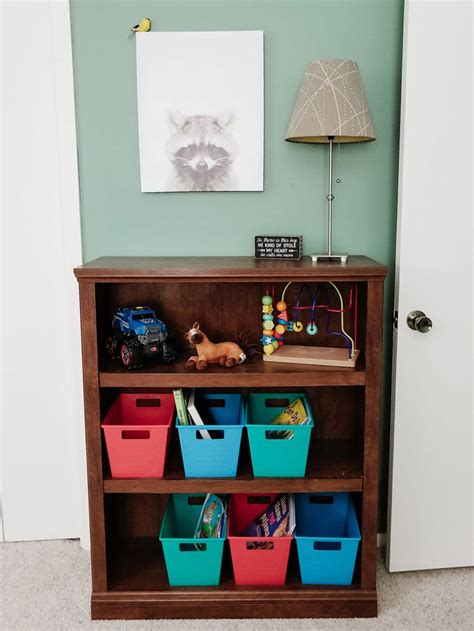 I attached the new headboard to the legs of the bed with wood screws. Toddler Room Ideas: DIY Woodland Toddler Boys Room