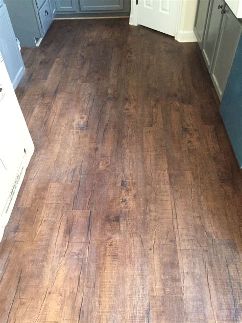 The perfect time to make transition from vinyl to carpet. Mohawk Luxury Vinyl Plank in Chocolate Barnwood | Luxury vinyl plank, Luxury vinyl plank ...