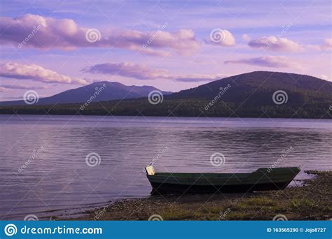Boat Moored On The Lake Stock Photo Image Of Sand Cloud 163565290