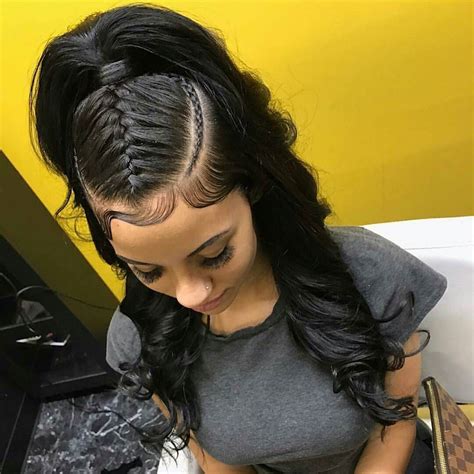 If your hair is not thick enough for this stunning 'do, try and replicate the braids and bun combo with weave, but don't forget to use bobby pins as a trendy accessory. quick weave #wave #waves #bodywave #layered | Trenzas ...