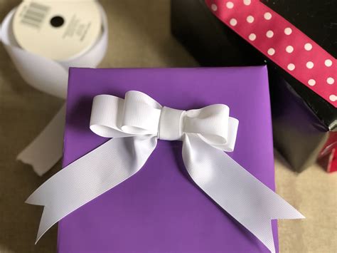 Once wrapped, add special trimmings and gift tags to your package. How to Make a Pretty Bow for Gift Wrapping