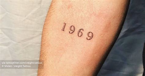 1969 Lettering Tattoo Placed On The Inner Forearm