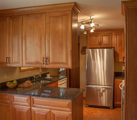 Oak kitchen cabinets work equally well with a natural finish or the paint color of your choice. Coffee Brown granite and AllWood Cabinets | Kitchen design ...