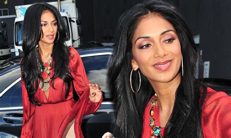 Nicole Scherzinger Flashes Some Leg As Her Dress Gets Lifted In The