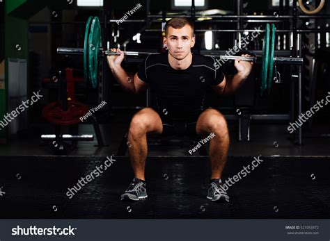Handsome Weightlifter Training Confident Muscular Man Stock Photo