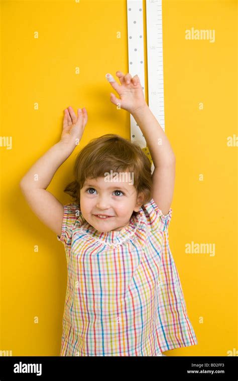 Toddler Girl Measuring Height Stock Photo Alamy