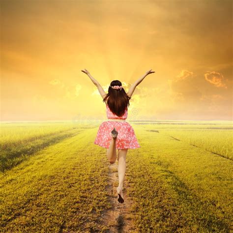Happy Woman Jump In Green Rice Fields And Sunset Stock Photo Image Of
