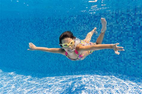 Happy Smiling Underwater Child In Swimming Pool Stock Photo Download